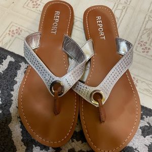 Report silver sandals. Womens size 8. 
Gently used. See pictures for wear.
